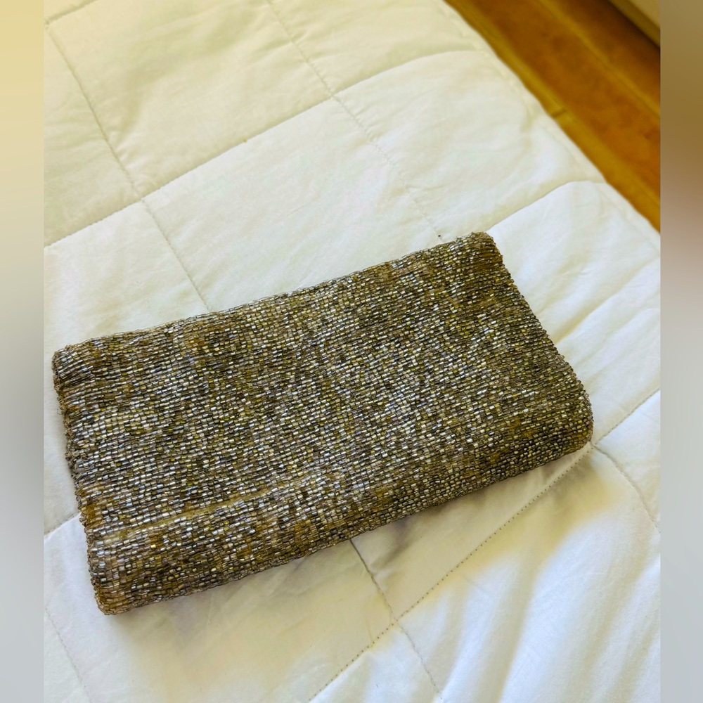 MOYNA beaded foldover clutch 
Size: 5” h x 9” w
Antique Gold
Good condition.